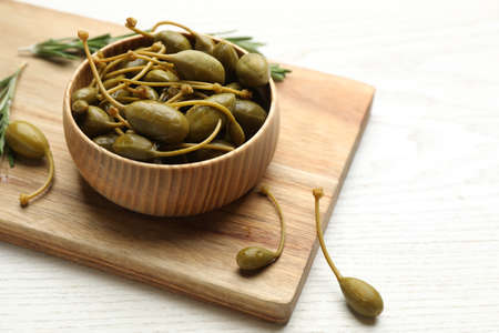 Tasty capers on white wooden table, space for textの写真素材