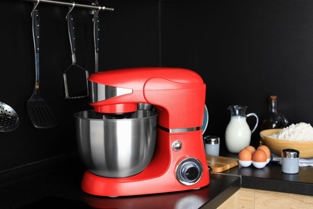 Modern stand mixer on countertop in kitchenの写真素材