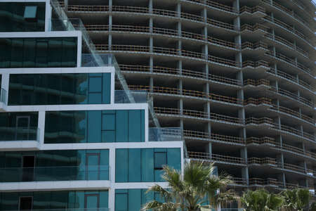 Modern and unfinished buildings outdoors. construction site