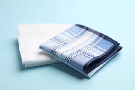 New stylish handkerchiefs on light blue backgroundの写真素材