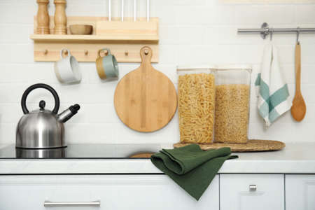 Clean towel on white countertop in kitchen