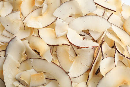 Delicious fresh coconut chips as background, closeupの写真素材
