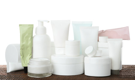 Set of different cosmetic products on wooden table against white backgroundの写真素材