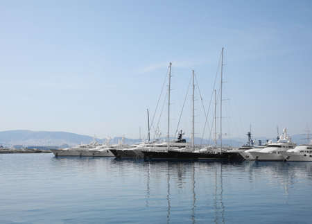 Beautiful view of different boats at pier on sunny dayの写真素材