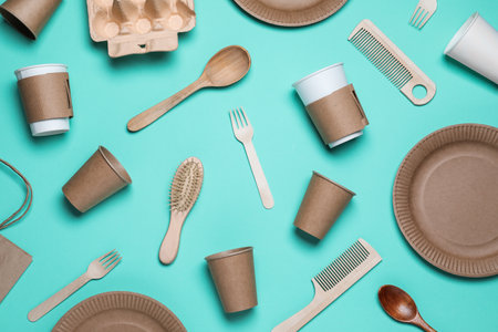 Different eco items on turquoise background, flat lay. Recycling conceptの写真素材
