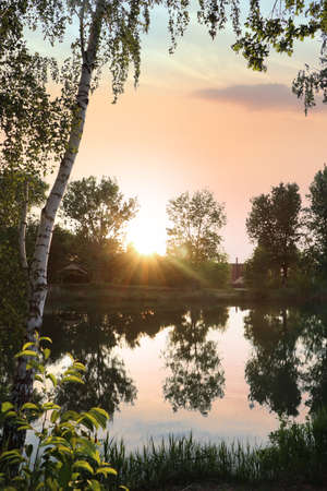 Picturesque view of the lake at sunrise. morning landscapeの写真素材