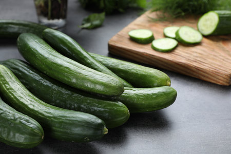 Fresh ripe cucumbers on gray table, closeupの写真素材