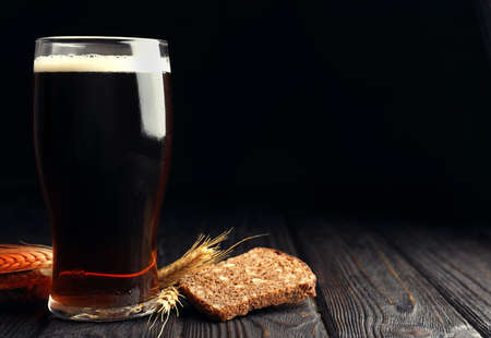 Delicious kvass, bread and spikes on wooden table. Space for textの写真素材