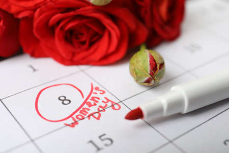 Roses and red marker on calendar near date 8th of March, closeup. International Women's Dayの写真素材