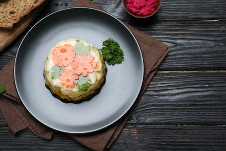 Delicious homemade chicken aspic served on black wooden table, flat lay