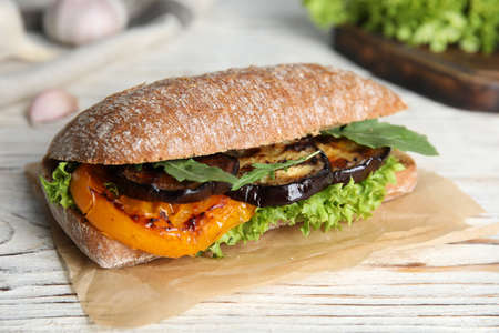 Delicious eggplant sandwich on white wooden tableの写真素材