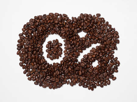 0 percent in coffee beans on white background, top view. Decaffeinated drinks
