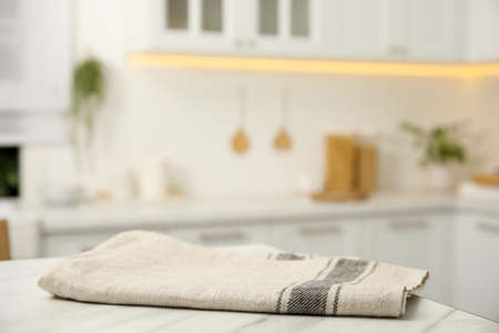 Clean towel on white marble table in kitchenの写真素材