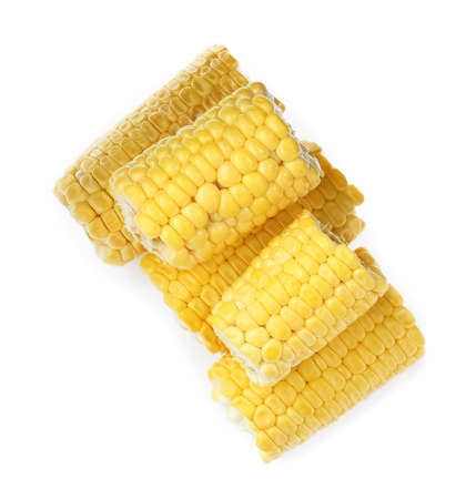 Pieces of corncobs on white background, top view