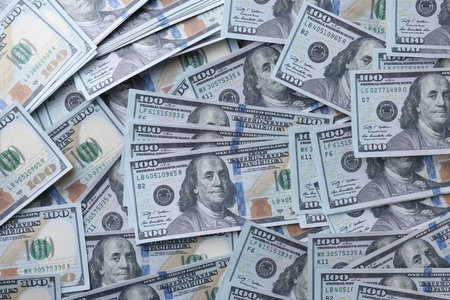 Dollar banknotes as background, top view. money exchange