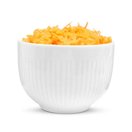 Fresh grated carrot in bowl isolated on whiteの写真素材