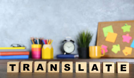 Word Translate made of wooden cubes with letters on tableの写真素材