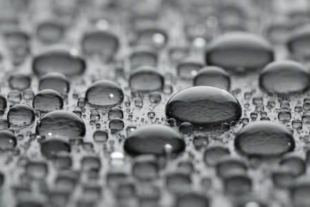 Water drops on gray background, closeup viewの写真素材