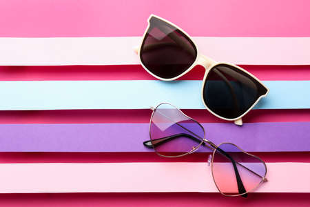 Different stylish sunglasses on color background, flat lay. Space for textの写真素材