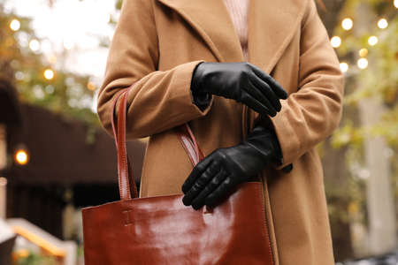 Young woman in black leather gloves, closeup. Stylish clothesの写真素材