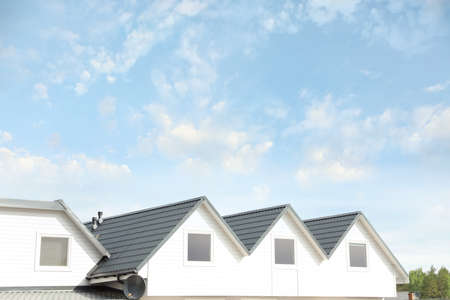 Modern building with gray roof outdoors on spring dayの写真素材