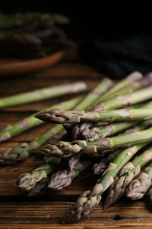 Fresh raw asparagus on wooden table, closeupの写真素材