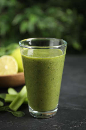 Delicious fresh green juice on black table, closeupの写真素材
