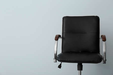 Comfortable office chair on light background. Space for textの写真素材