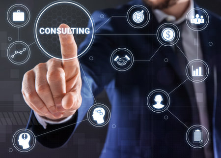 Man pointing at icon CONSULTING on virtual screen, closeupの写真素材