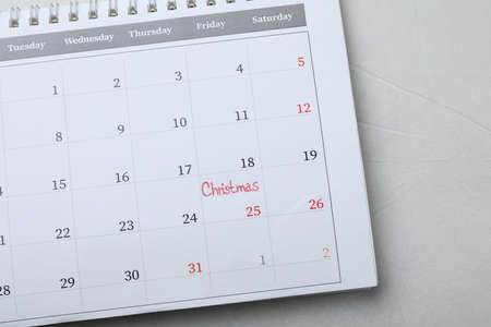Calendar with word Christmas on gray stone table, top view. holiday count downの写真素材