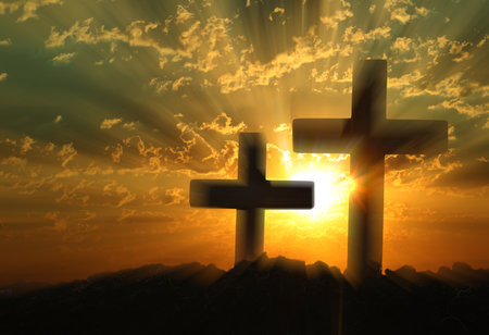 Silhouette of Christian crosses outdoors at sunsetの写真素材