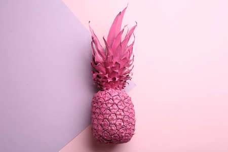 Pink pineapple on color background, top view. creative conceptの写真素材