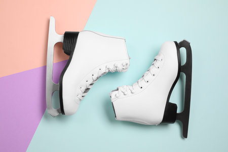 Pair of skates on color background, flat layの写真素材