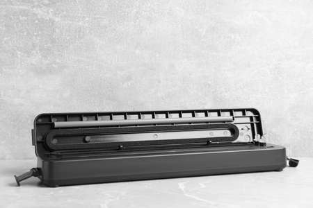 Sealer for vacuum packing on light gray marble table