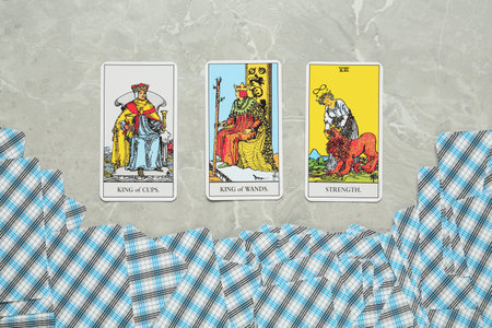 Tarot cards on light gray marble table, flat layの写真素材