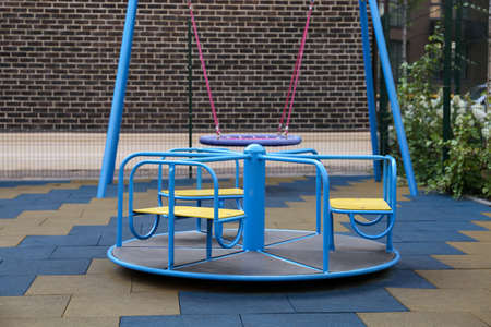 Colorful carousel for children on outdoor playground