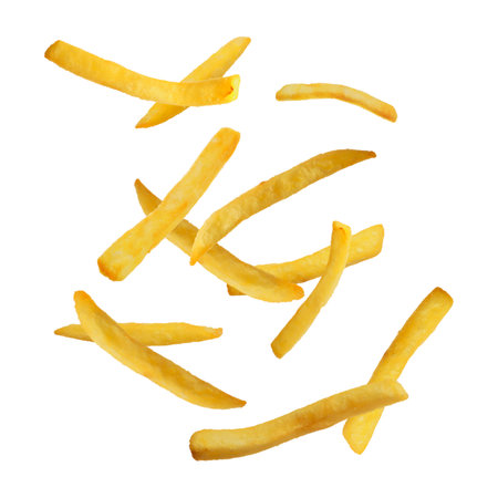 Tasty french fries falling on white background