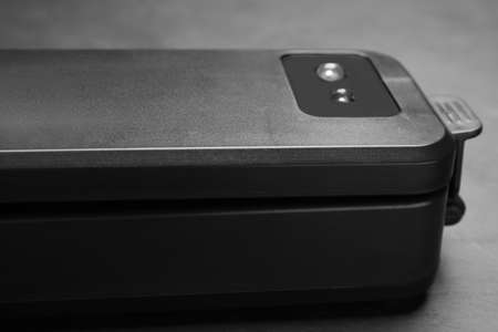 Sealer for vacuum packing on slate table, closeupの写真素材