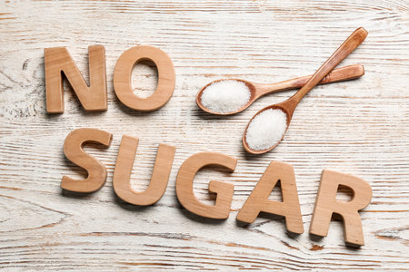 Flat lay composition with phrase No Sugar on white wooden tableの写真素材