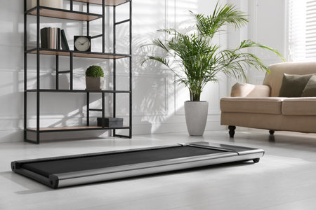 Modern walking treadmill in living room. home gym equipmentの写真素材