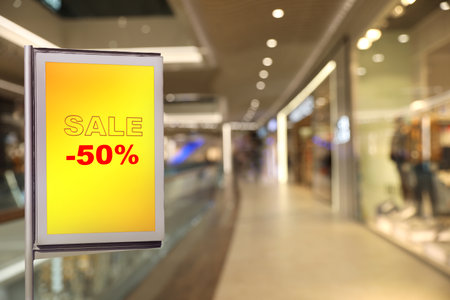 board Advertising with text SALE and 50 percent discount in shopping mall. special promotionの写真素材