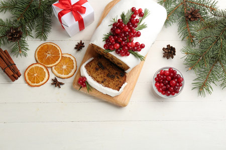 Traditional Christmas cake and ingredients on white wooden table, flat lay. classic recipeの写真素材