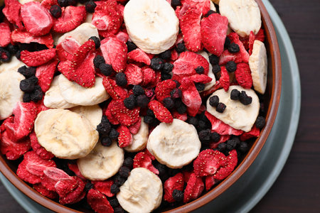 Bowl of different freeze dried fruits on table, closeupの写真素材