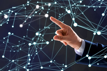 Man using virtual screen with connection lines presenting innovation network linkage on dark...