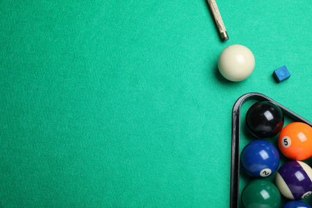Flat lay composition with balls on billiard table, space for textの写真素材
