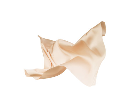 Beautiful delicate pale pink silk floating on white backgroundの写真素材