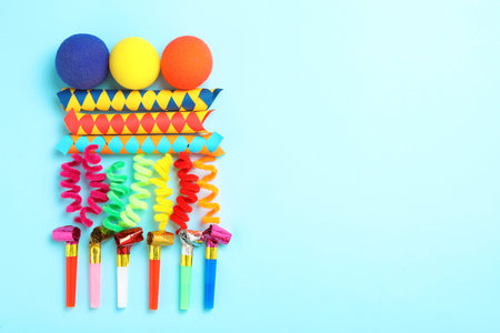 Different clown's accessories on light blue background, flat lay. Space for textの写真素材