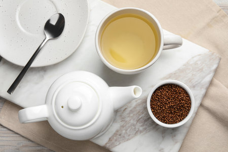 Freshly made buckwheat tea and granules on table, top viewの写真素材