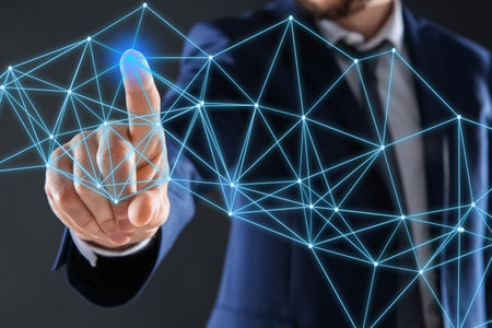 Man using virtual screen with connection lines presenting innovation network linkage on dark...