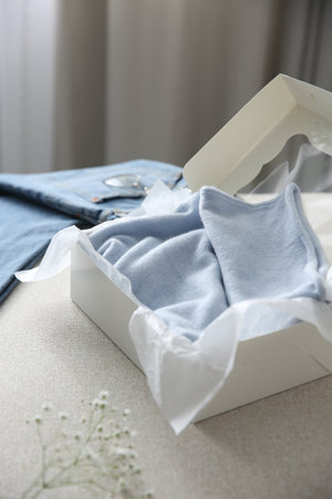 Soft cashmere sweater in box on sofaの写真素材